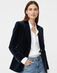 Women's green velvet blazer with gold-tone buttons