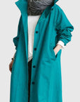 Women's light grey oversized hooded parka with adjustable hood