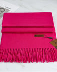 Women's bright pink cashmere scarf with tassel trim
