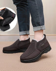 Men's black slip-on shoes with plush warm lining for winter home and casual wear