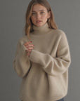 Women's beige oversized cashmere turtleneck jumper