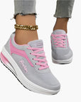 Women's orthopedic sneakers in black with supportive air cushion footbed