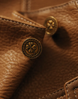 Women's brown leather jacket with collar and front pockets