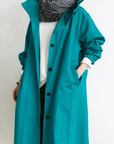 Women's grey waterproof raincoat with oversized hood