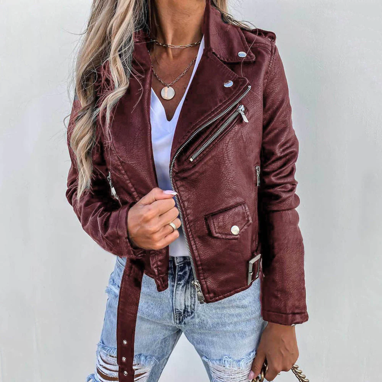 Women's red leather jacket with high collar and waist belt