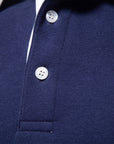 Men's blue long-sleeve knit polo jumper with classic collar