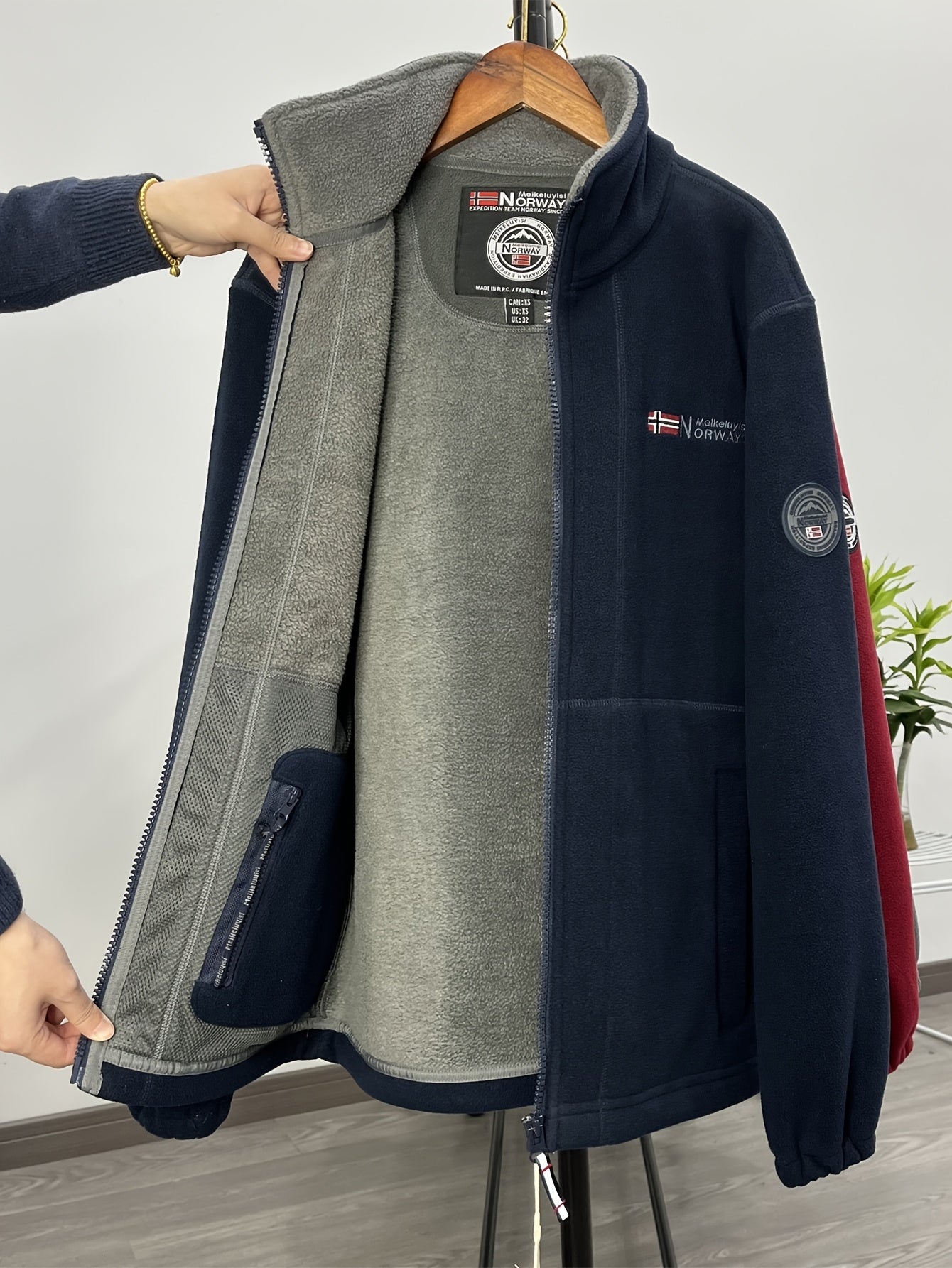 Men's navy outdoor fleece jacket with full zip and high collar