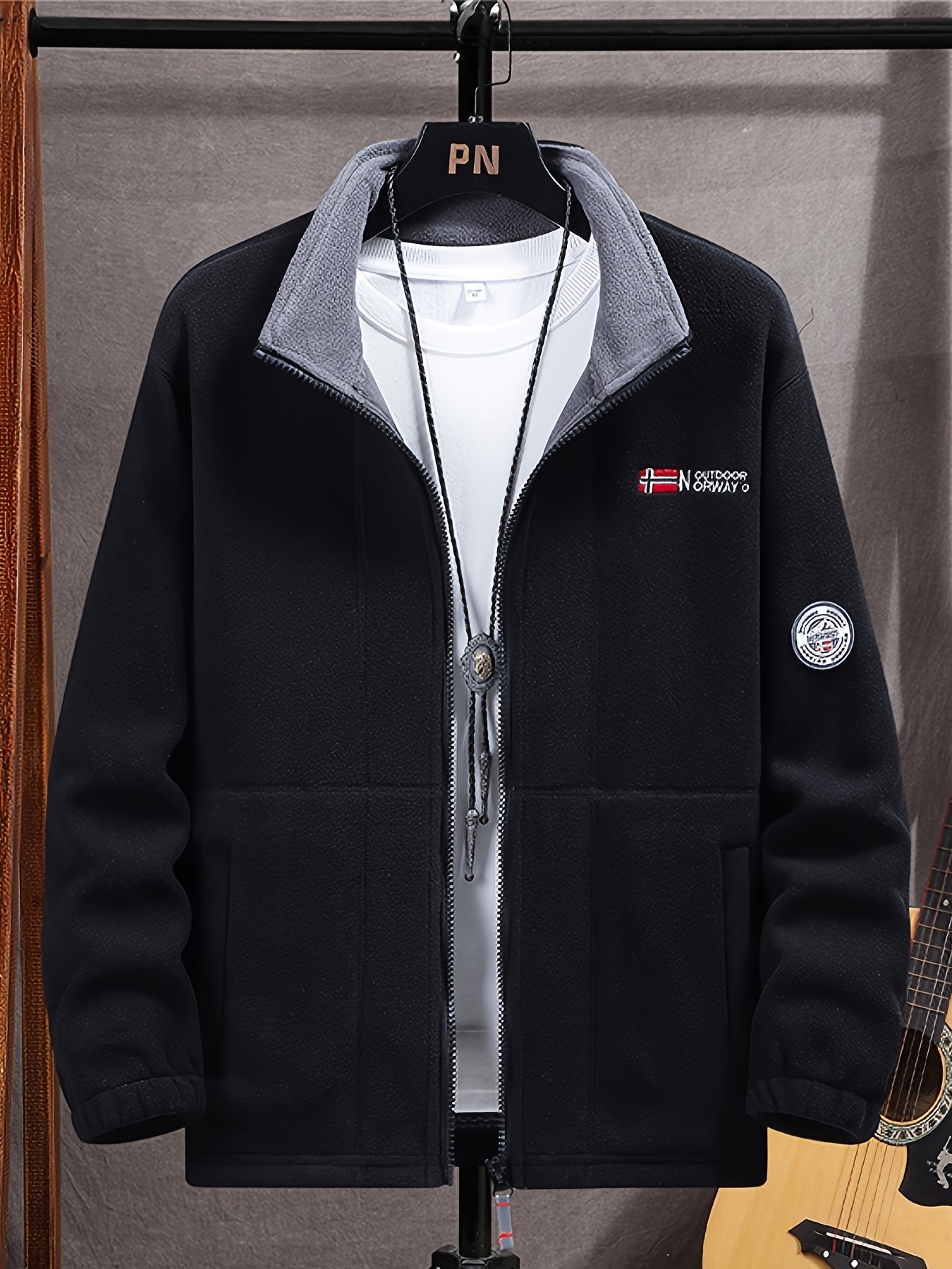 Men's navy outdoor fleece jacket with full zip and high collar