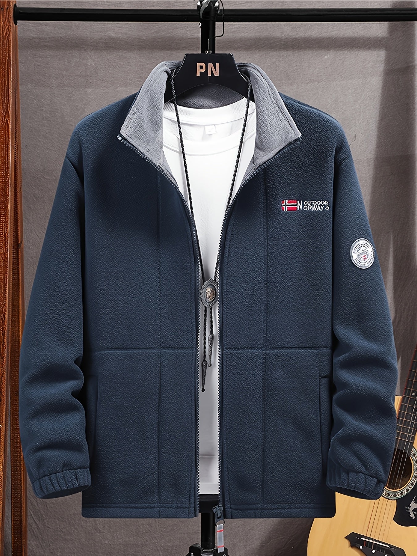 Men's navy outdoor fleece jacket with full zip and high collar
