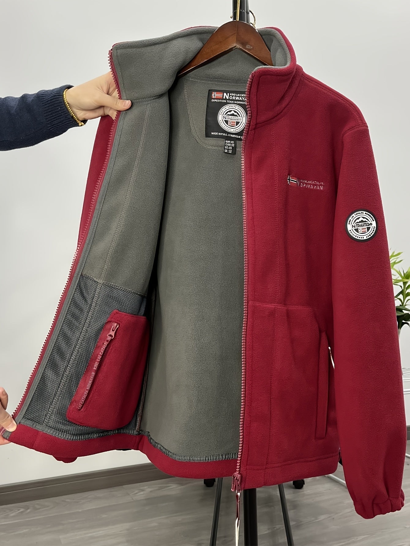 Men's navy outdoor fleece jacket with full zip and high collar