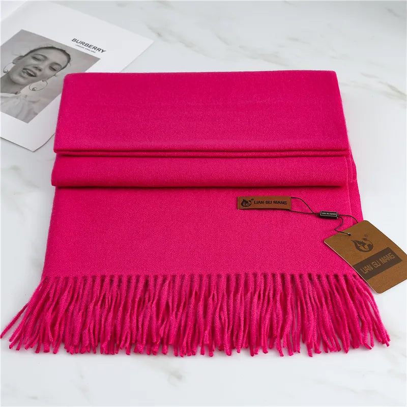 Women's bright pink cashmere scarf with tassel trim
