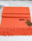 Women's orange cashmere scarf with tassel trim