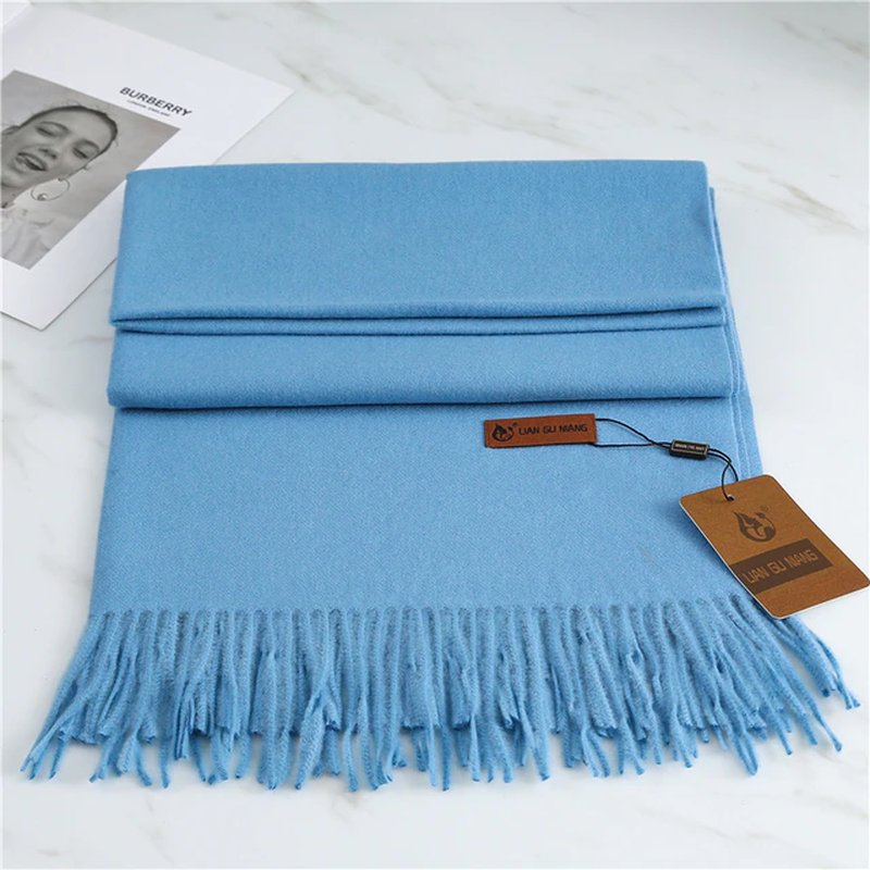 Women's blue cashmere scarf with tassel trim