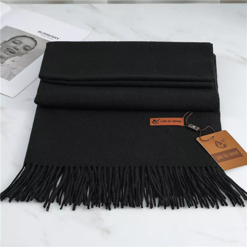 Women's black cashmere scarf with tassel trim