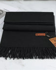 Women's black cashmere scarf with tassel trim