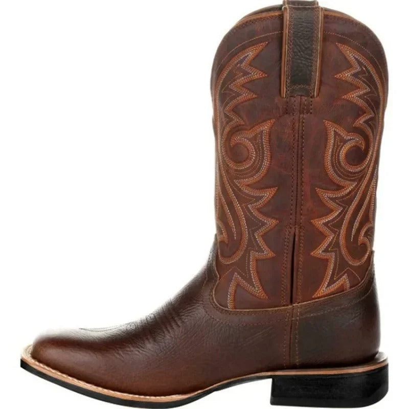 Men's brown cowboy boots with decorative western stitching and classic pointed toe