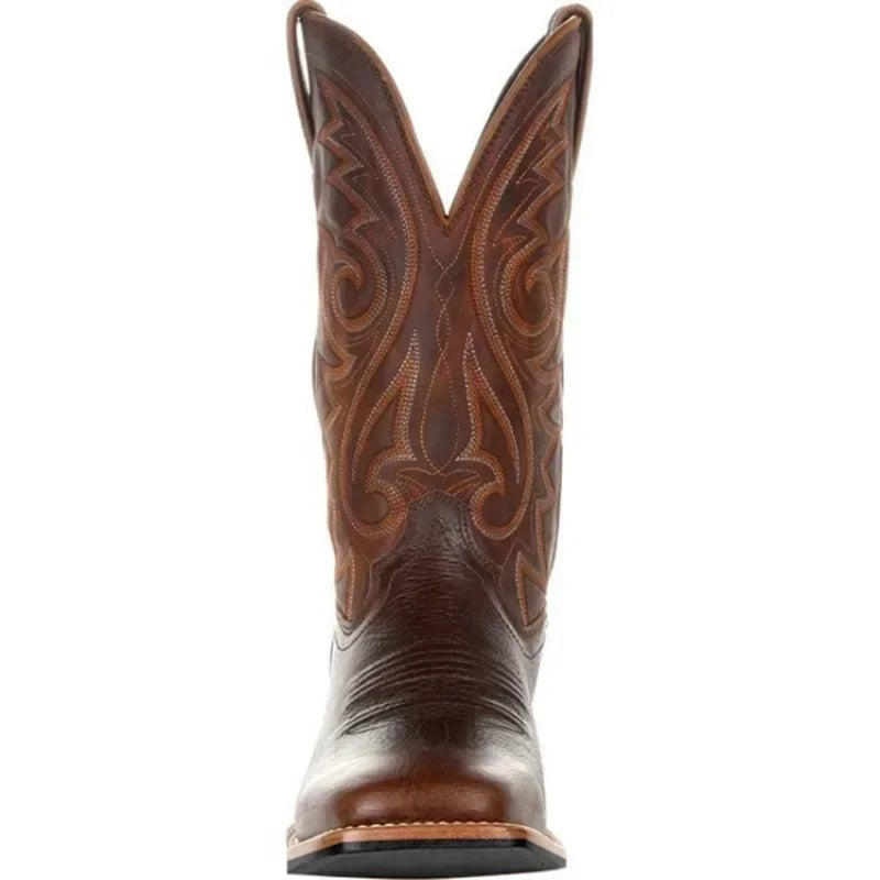 Men's brown cowboy boots with decorative western stitching and classic pointed toe