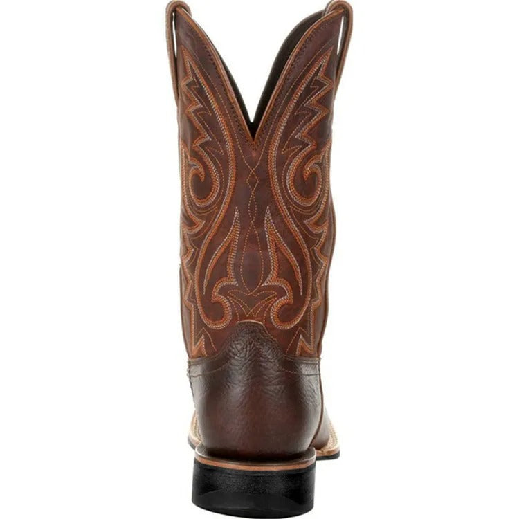 Men's brown cowboy boots with decorative western stitching and classic pointed toe