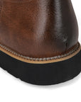 Men's brown cowboy boots with decorative western stitching and classic pointed toe