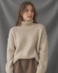 Women's beige oversized cashmere turtleneck jumper