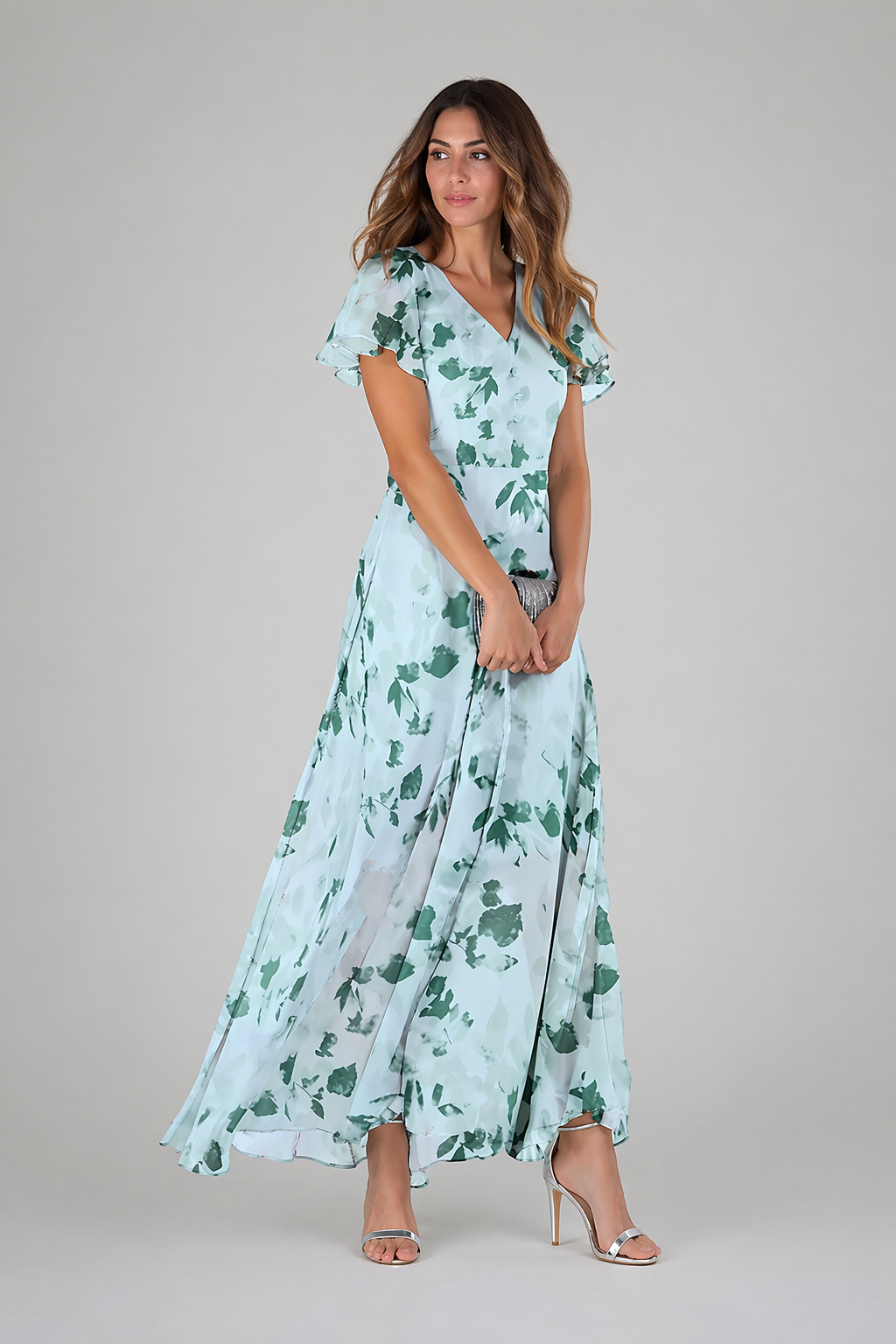 Woman wearing a floral dress on a plain background