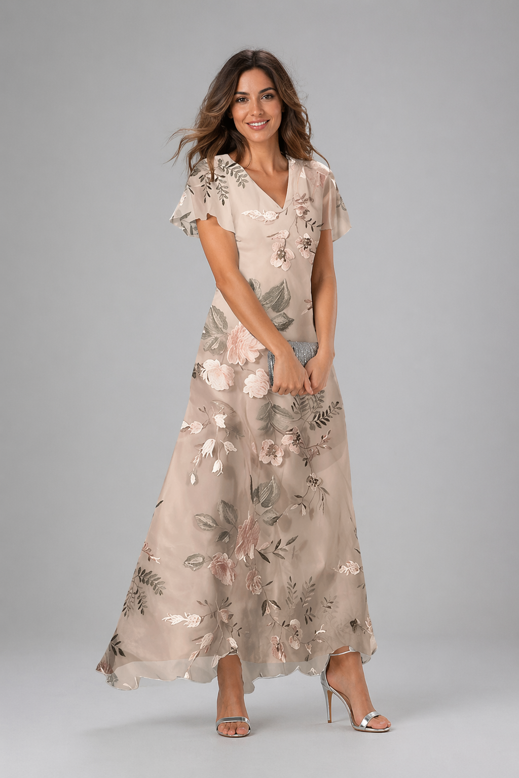 Woman wearing a floral dress on a gray background
